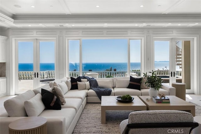 71 Ritz Cove Dr, Dana Point, CA 92629 - living room with crown molding, a water view, french doors, recessed lighting, and coffered ceiling