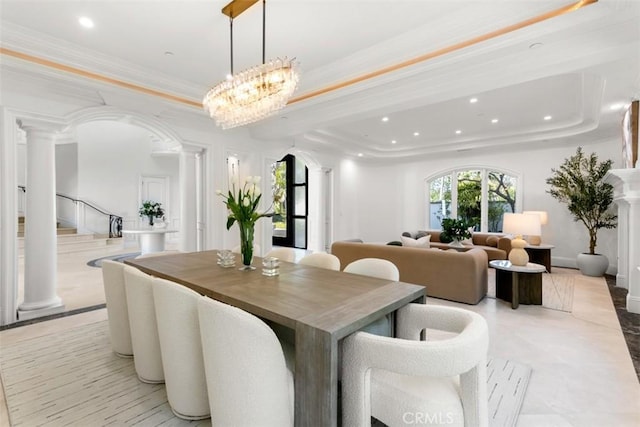 71 Ritz Cove Dr, Dana Point, CA 92629 - dining area featuring a tray ceiling, ornate columns, recessed lighting, a chandelier, and ornamental molding