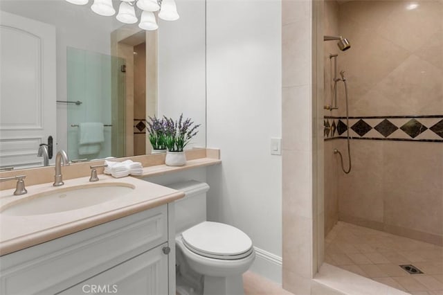 71 Ritz Cove Dr, Dana Point, CA 92629 - bathroom featuring a tile shower, toilet, and vanity