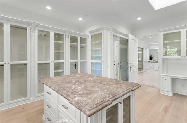 71 Ritz Cove Dr, Dana Point, CA 92629 - walk in closet with light wood finished floors and a skylight