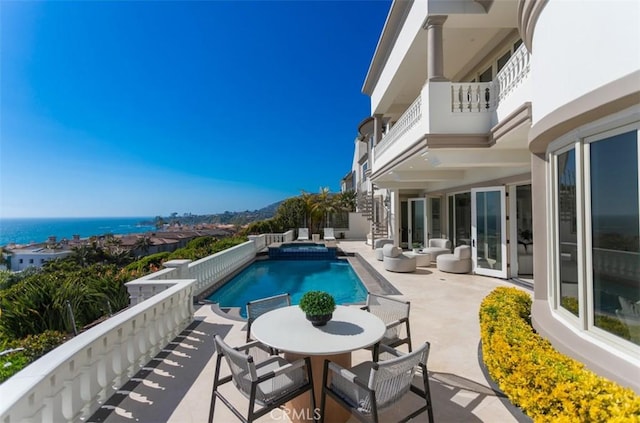 71 Ritz Cove Dr, Dana Point, CA 92629 - view of pool with a pool with connected hot tub, a patio area, and outdoor dining area