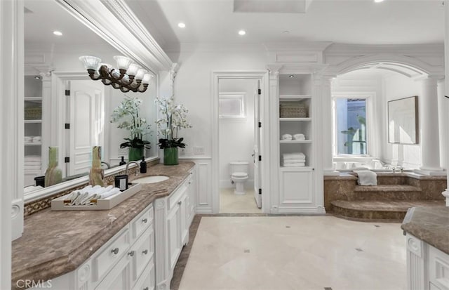 71 Ritz Cove Dr, Dana Point, CA 92629 - full bath with ornate columns, vanity, ornamental molding, healthy amount of natural light, and recessed lighting