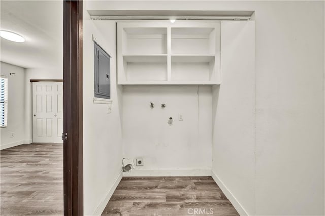 19270 Mountain S, Hidden Valley Lake, CA 95467 - washroom with hookup for an electric dryer, wood finished floors, hookup for a washing machine, electric panel, and baseboards