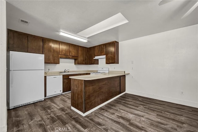 19270 Mountain S, Hidden Valley Lake, CA 95467 - kitchen featuring white appliances, under cabinet range hood, a sink, dark wood-style floors, and light countertops