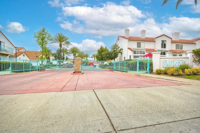 surrounding community with fence and a gate