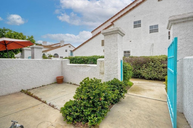 view of patio / terrace featuring fence