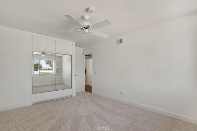 3238 N Hartman St, Orange, CA 92865 - unfurnished bedroom with light carpet, baseboards, a closet, and ceiling fan