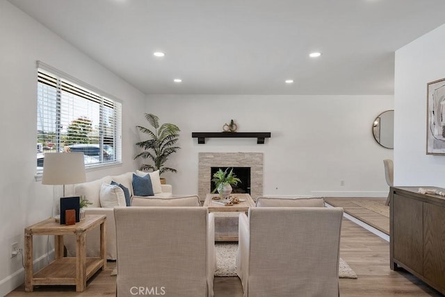 3238 N Hartman St, Orange, CA 92865 - living room featuring light wood-style flooring, recessed lighting, a fireplace, and baseboards