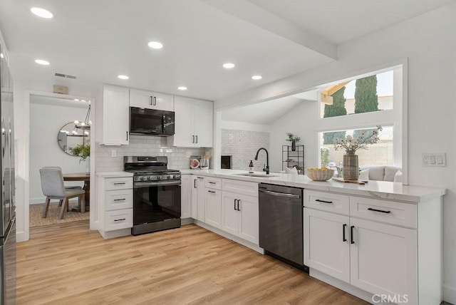 3238 N Hartman St, Orange, CA 92865 - kitchen with appliances with stainless steel finishes, a sink, tasteful backsplash, white cabinets, and a peninsula