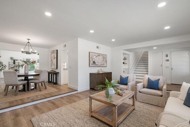 3238 N Hartman St, Orange, CA 92865 - living area featuring stairs, a chandelier, baseboards, light wood finished floors, and recessed lighting