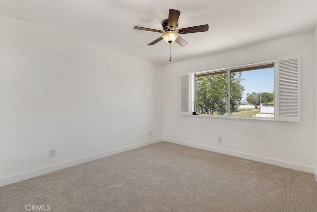 3238 N Hartman St, Orange, CA 92865 - spare room featuring baseboards, a ceiling fan, and light carpet