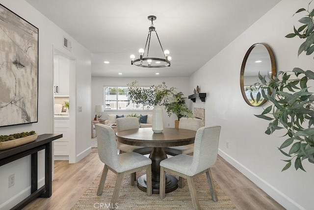 3238 N Hartman St, Orange, CA 92865 - dining area with a chandelier, light wood-style flooring, recessed lighting, and baseboards