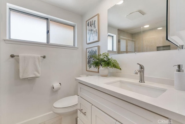 3238 N Hartman St, Orange, CA 92865 - bathroom with tiled shower, vanity, toilet, and baseboards