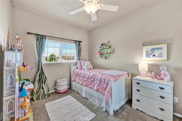 carpeted bedroom featuring ceiling fan and baseboards