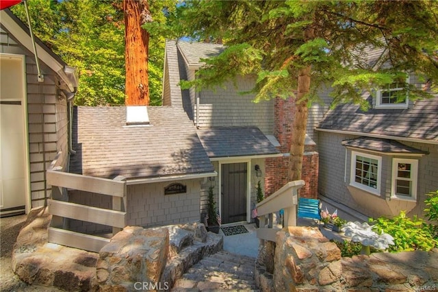 27844 Greenway Dr, Lake Arrowhead, CA 92352 - view of front facade featuring roof with shingles