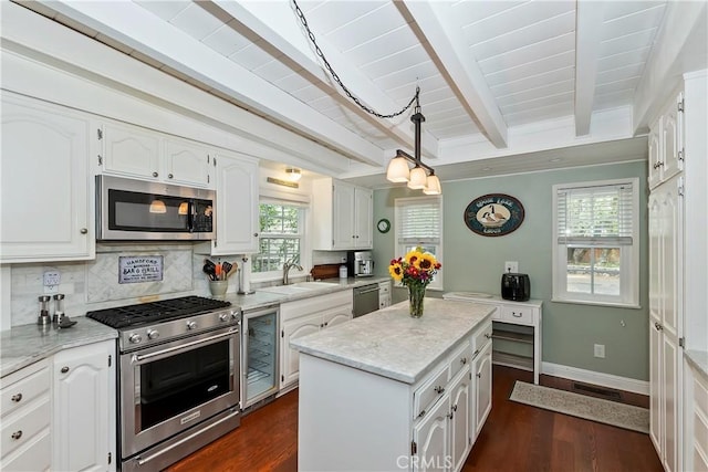 27844 Greenway Dr, Lake Arrowhead, CA 92352 - kitchen with appliances with stainless steel finishes, wine cooler, white cabinetry, beamed ceiling, and a sink