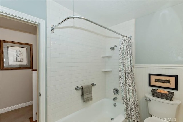 27844 Greenway Dr, Lake Arrowhead, CA 92352 - full bathroom with shower / tub combo with curtain, a wainscoted wall, and toilet