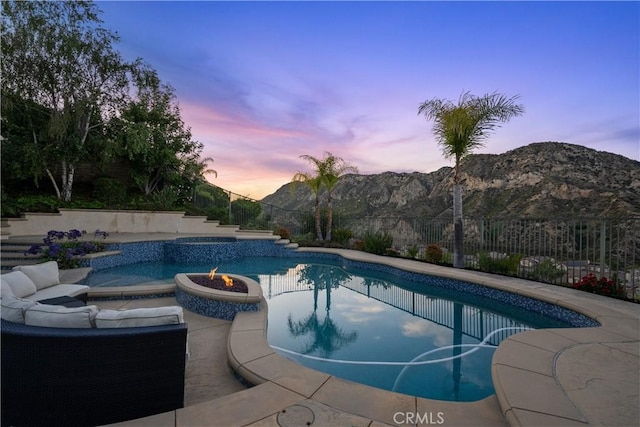25865 Tulip Grove St, Stevenson Ranch, CA 91381 - view of swimming pool with a mountain view, a patio, and a pool with connected hot tub