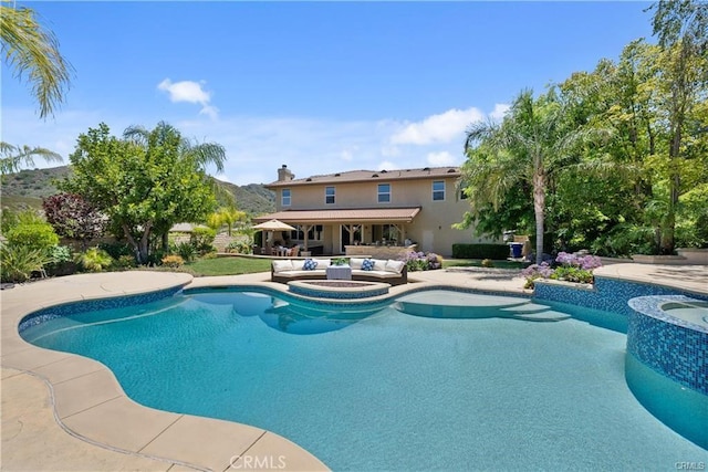 25865 Tulip Grove St, Stevenson Ranch, CA 91381 - view of swimming pool with a pool with connected hot tub and a patio
