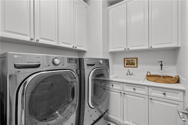 25865 Tulip Grove St, Stevenson Ranch, CA 91381 - laundry area featuring cabinet space and washing machine and dryer