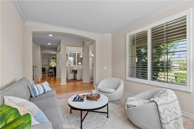 25865 Tulip Grove St, Stevenson Ranch, CA 91381 - living room with arched walkways, crown molding, healthy amount of natural light, and wood finished floors