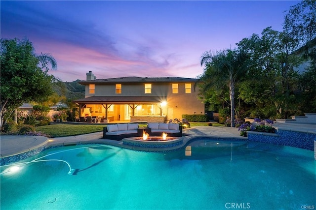 25865 Tulip Grove St, Stevenson Ranch, CA 91381 - outdoor pool featuring a patio and an outdoor living space with a fire pit