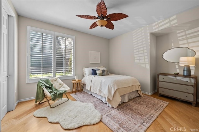 25865 Tulip Grove St, Stevenson Ranch, CA 91381 - bedroom with multiple windows, wood finished floors, and ceiling fan