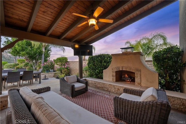 25865 Tulip Grove St, Stevenson Ranch, CA 91381 - view of patio featuring an outdoor living space with a fireplace, outdoor dining area, and ceiling fan
