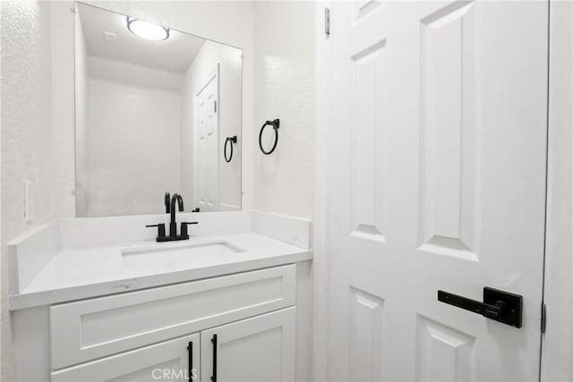 14118 Orizaba Ave Unit 7, Paramount, CA 90723 - bathroom with vanity and a textured wall