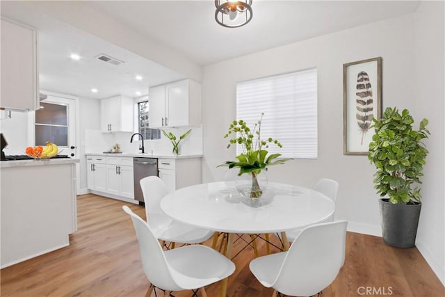 14118 Orizaba Ave Unit 7, Paramount, CA 90723 - dining room with light wood-style floors, baseboards, and recessed lighting