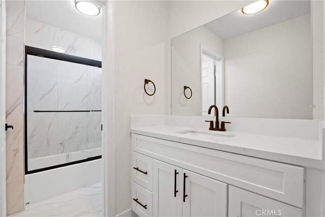 14118 Orizaba Ave Unit 7, Paramount, CA 90723 - full bathroom with marble look tile flooring, shower / bath combination with glass door, and vanity