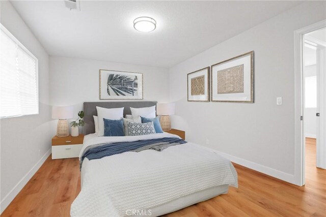 14118 Orizaba Ave Unit 7, Paramount, CA 90723 - bedroom with baseboards and wood finished floors