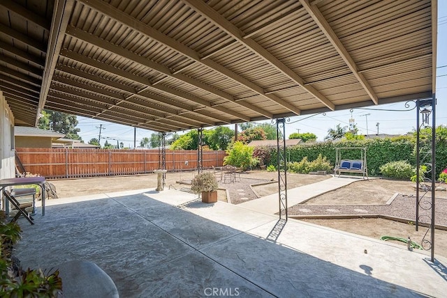 view of patio featuring fence