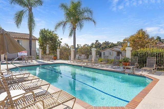 7488 Altiva Pl, Carlsbad, CA 92009 - community pool with fence and a patio area