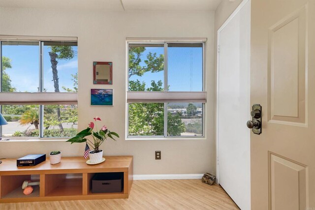 7488 Altiva Pl, Carlsbad, CA 92009 - doorway to outside with wood finished floors and baseboards