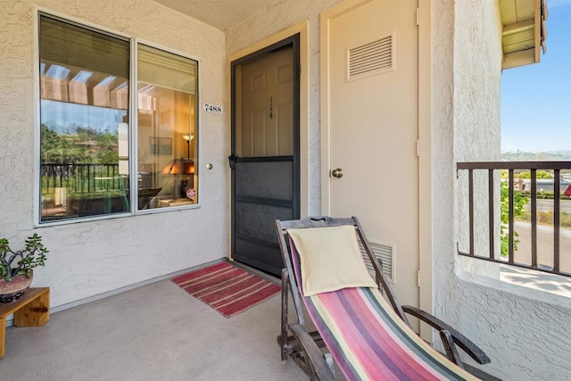 7488 Altiva Pl, Carlsbad, CA 92009 - property entrance with stucco siding