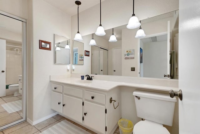 7488 Altiva Pl, Carlsbad, CA 92009 - full bath with toilet, tile patterned flooring, a shower, vanity, and baseboards