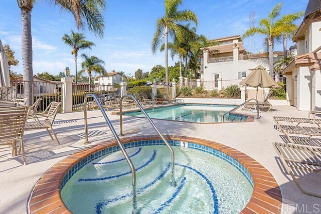 7488 Altiva Pl, Carlsbad, CA 92009 - community pool featuring fence, a community hot tub, and a patio