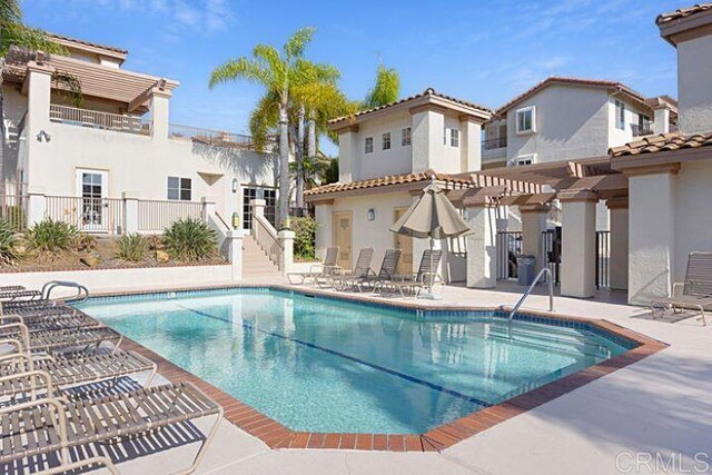 7488 Altiva Pl, Carlsbad, CA 92009 - community pool with a patio and a pergola