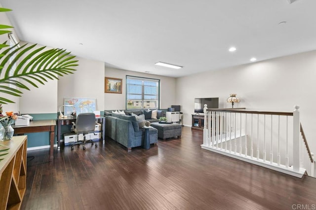 living area with wood finished floors, a desk, recessed lighting, and baseboards