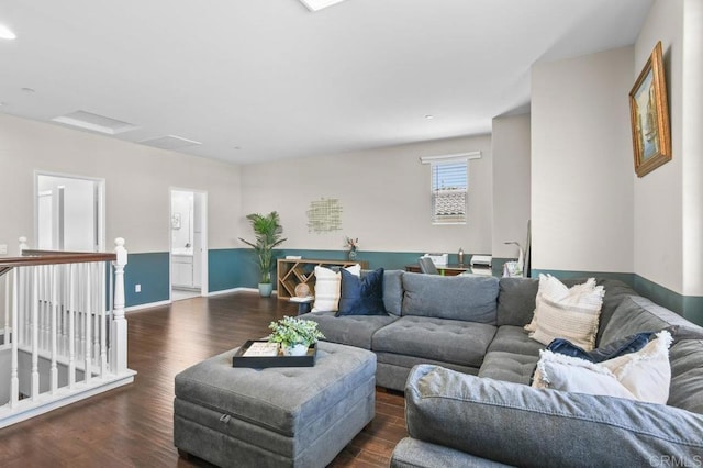 living room featuring wood finished floors, baseboards, and recessed lighting