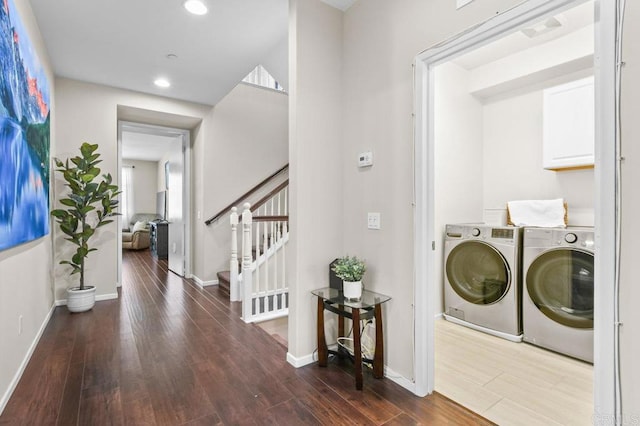 laundry room with wood finished floors, washing machine and clothes dryer, baseboards, and recessed lighting