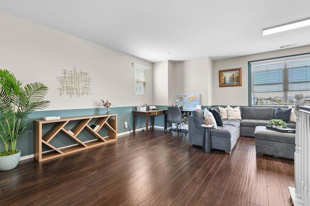 living room featuring wood finished floors and baseboards