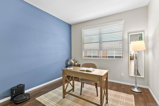home office with wood finished floors and baseboards