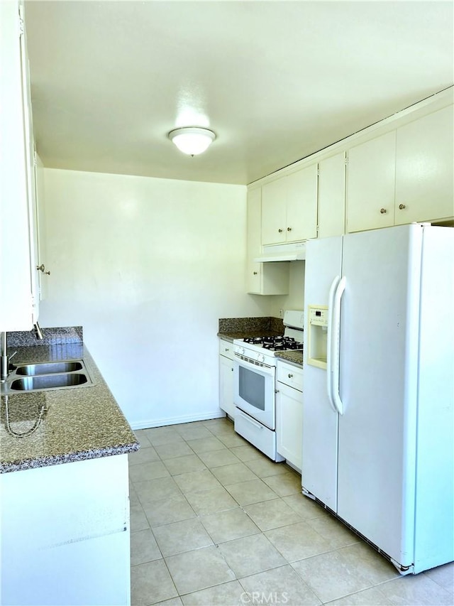 2616 Gates Ave, Redondo Beach, CA 90278 - kitchen featuring white appliances, under cabinet range hood, a sink, white cabinets, and dark stone counters