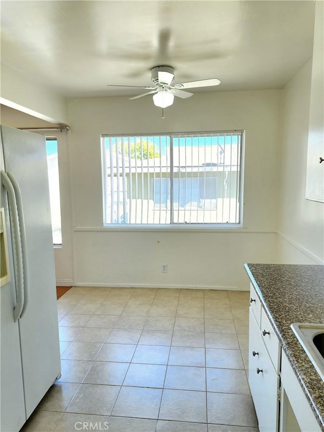 2616 Gates Ave, Redondo Beach, CA 90278 - kitchen with white refrigerator with ice dispenser, healthy amount of natural light, ceiling fan, and light tile patterned floors