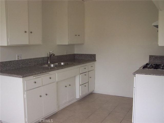 2616 Gates Ave, Redondo Beach, CA 90278 - kitchen featuring a sink, gas stovetop, white cabinets, and baseboards