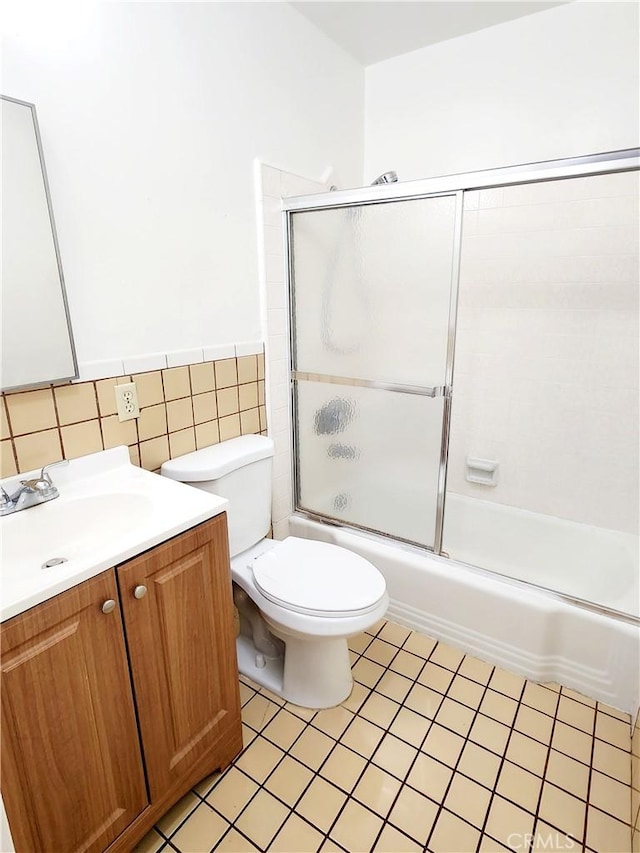 2616 Gates Ave, Redondo Beach, CA 90278 - full bath with vanity, bath / shower combo with glass door, tile walls, toilet, and tile patterned flooring