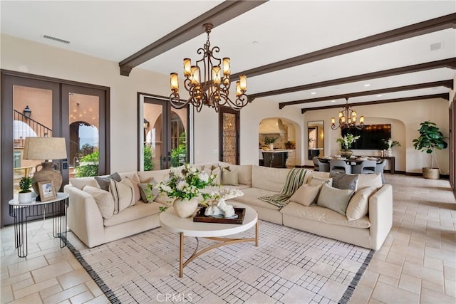7 Ocean Heights Dr, Newport Coast, CA 92657 - living area featuring a chandelier, arched walkways, beamed ceiling, stone tile flooring, and recessed lighting