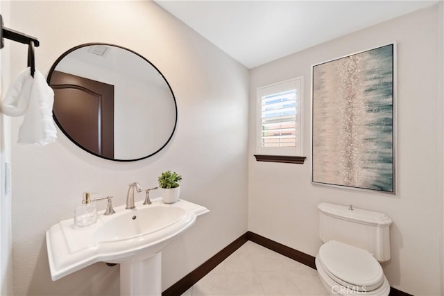 7 Ocean Heights Dr, Newport Coast, CA 92657 - half bathroom featuring baseboards, toilet, tile patterned flooring, and a sink